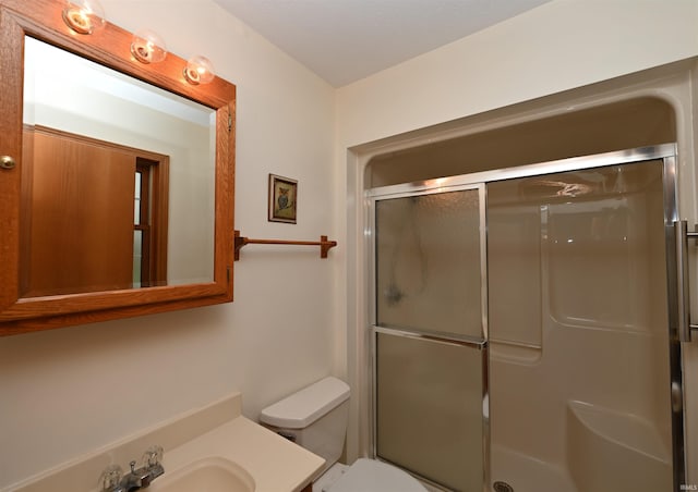 800 E Oak View Est, Winamac, IN 46996 - bathroom with vanity, toilet, and a stall shower