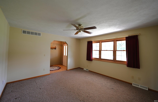 800 E Oak View Est, Winamac, IN 46996 - unfurnished room with arched walkways, ceiling fan, and visible vents