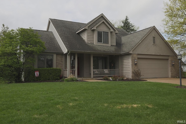 view of front facade featuring covered porch, an attached garage, a shingled roof, and a front lawn