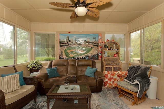 sunroom with tile patterned floors and a decorative wall