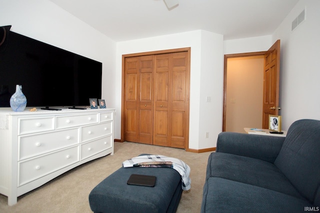 living room featuring light colored carpet and visible vents