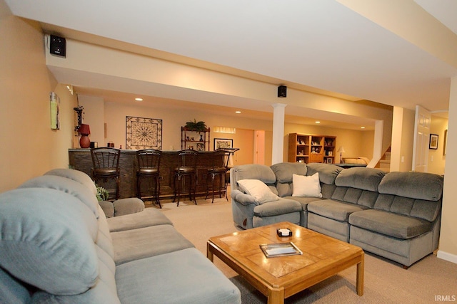 living room featuring indoor bar, recessed lighting, light colored carpet, and stairway