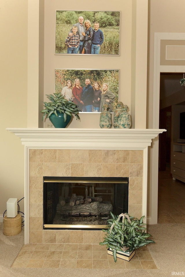 interior details with a tiled fireplace