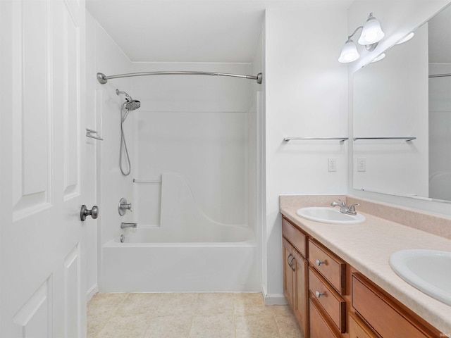 bathroom featuring double vanity, bathing tub / shower combination, and a sink