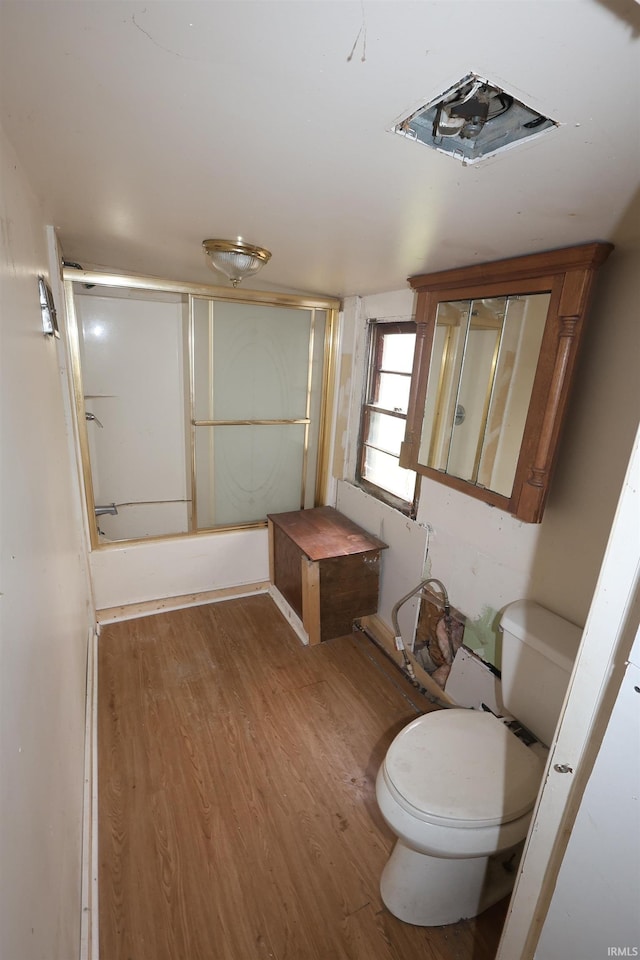 full bathroom with wood finished floors and toilet