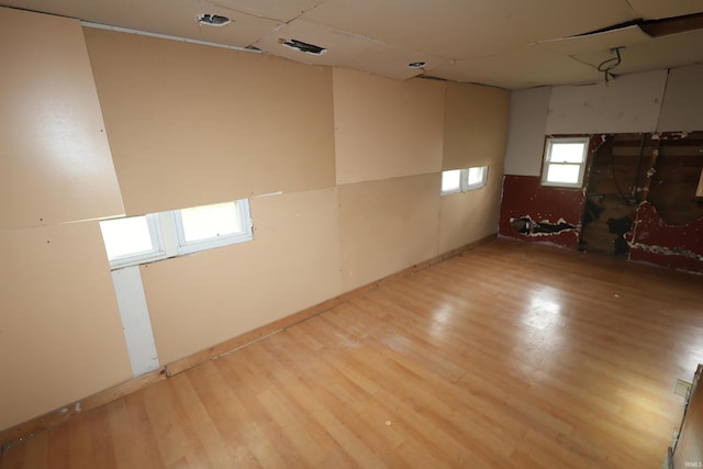unfurnished room with wood finished floors