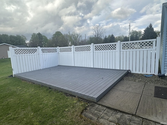 view of patio with fence and a wooden deck