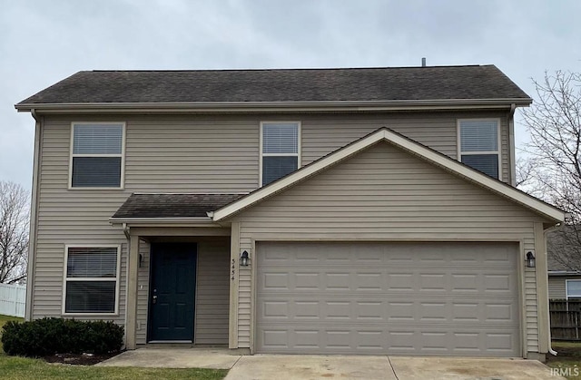 view of front facade featuring fence, driveway, and a shingled roof