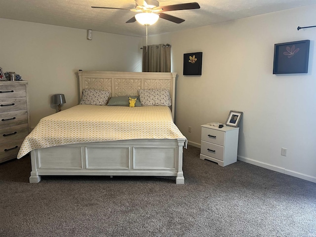 bedroom with a ceiling fan, baseboards, and dark carpet