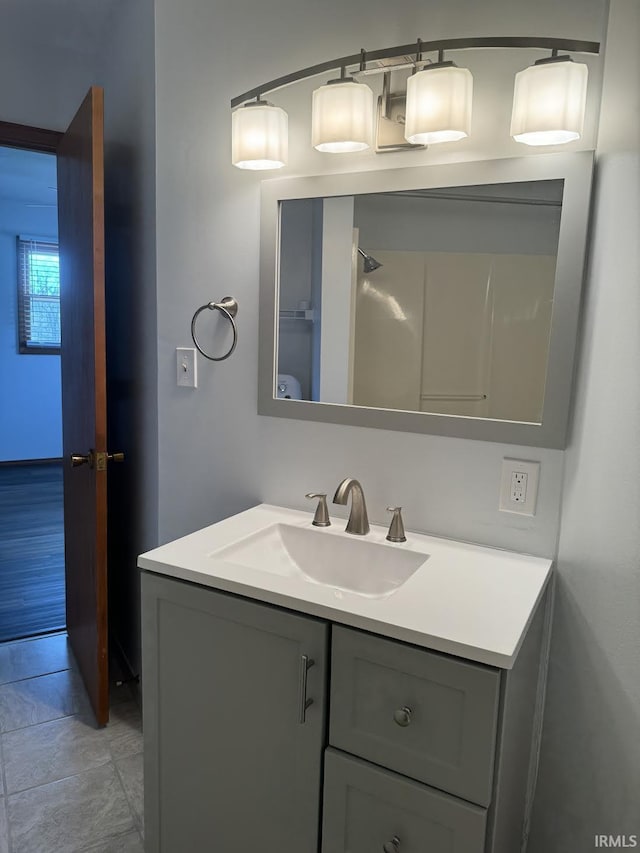 bathroom featuring vanity and tile patterned flooring