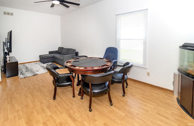 playroom featuring light wood-style floors, baseboards, a ceiling fan, and visible vents