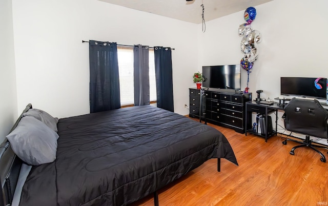 bedroom with wood finished floors