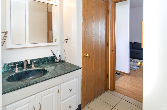 bathroom featuring vanity and tile patterned flooring