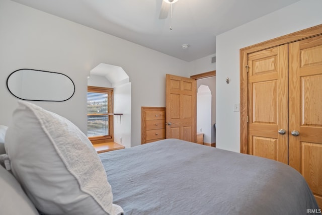 bedroom featuring ceiling fan and a closet