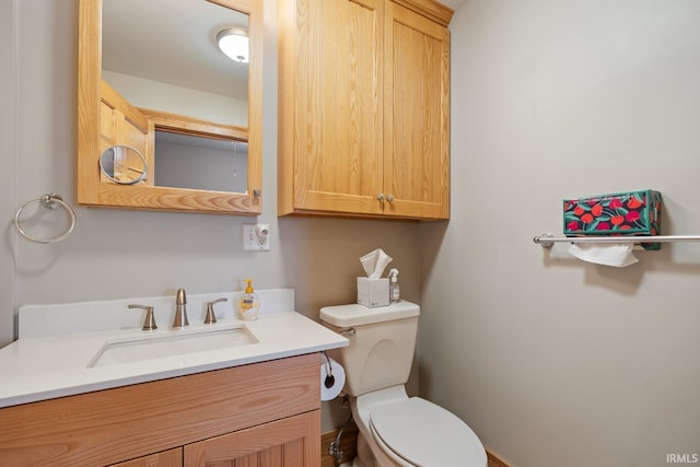 half bath with vanity and toilet