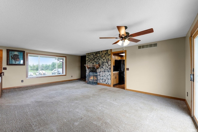 5155 E 200 N, Columbia City, IN 46725 - unfurnished living room with plenty of natural light, carpet, a ceiling fan, and visible vents