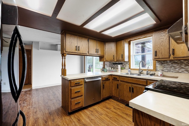 5155 E 200 N, Columbia City, IN 46725 - kitchen with a sink, brown cabinetry, backsplash, and dishwasher