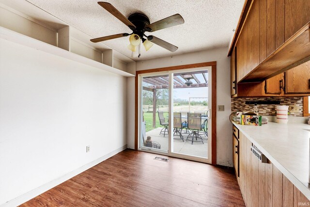 5155 E 200 N, Columbia City, IN 46725 - unfurnished dining area featuring a textured ceiling, a ceiling fan, wood finished floors, and visible vents
