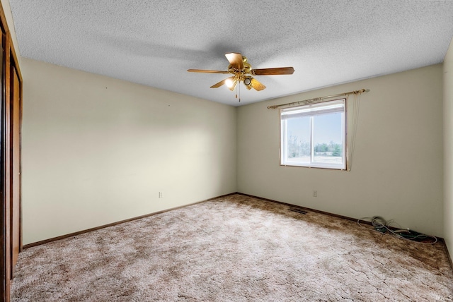 5155 E 200 N, Columbia City, IN 46725 - unfurnished room featuring baseboards, carpet flooring, a textured ceiling, and a ceiling fan