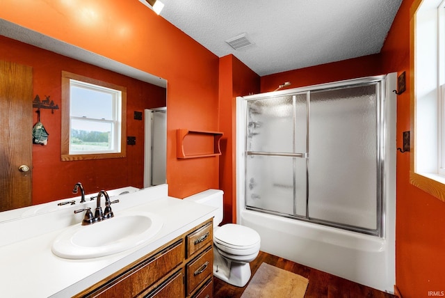 5155 E 200 N, Columbia City, IN 46725 - full bathroom featuring a textured ceiling, visible vents, wood finished floors, vanity, and toilet