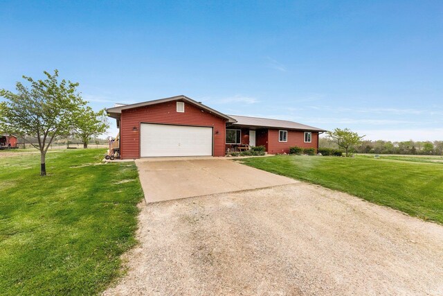 5155 E 200 N, Columbia City, IN 46725 - ranch-style house featuring an attached garage, driveway, and a front lawn