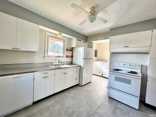 kitchen with a ceiling fan, independent washer and dryer, a sink, white cabinets, and white appliances