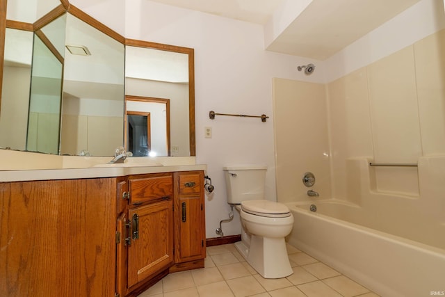 bathroom featuring vanity, toilet, baseboards, shower / tub combination, and tile patterned floors