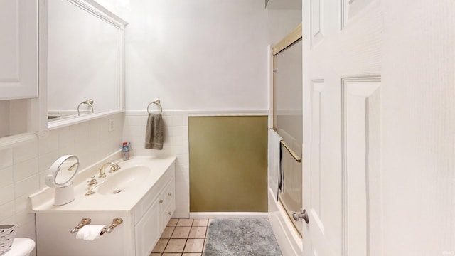 bathroom featuring vanity, tile patterned floors, and toilet