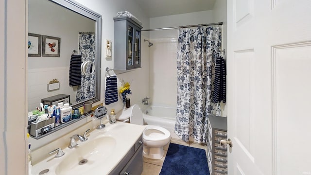 bathroom featuring tile patterned flooring, shower / bath combo, toilet, and vanity