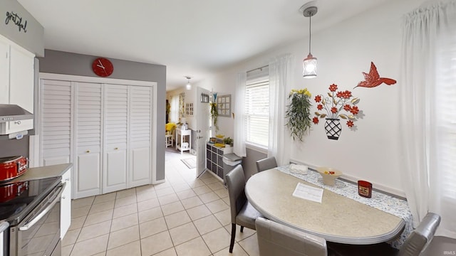 dining space with light tile patterned floors