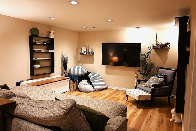 living room featuring recessed lighting and wood finished floors