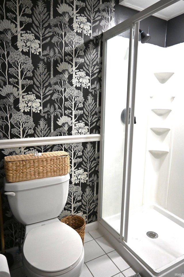 full bath with tile patterned flooring, a shower stall, wallpapered walls, and toilet