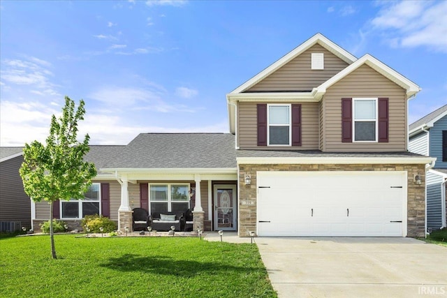 359 Limestone Ct, Lafayette, IN 47909 - view of front facade with a front lawn, stone siding, a garage, concrete driveway, and covered porch