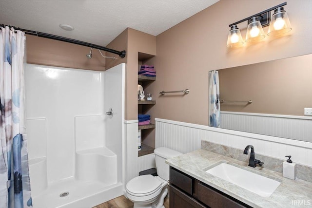 359 Limestone Ct, Lafayette, IN 47909 - full bath with wainscoting, vanity, toilet, a textured ceiling, and curtained shower