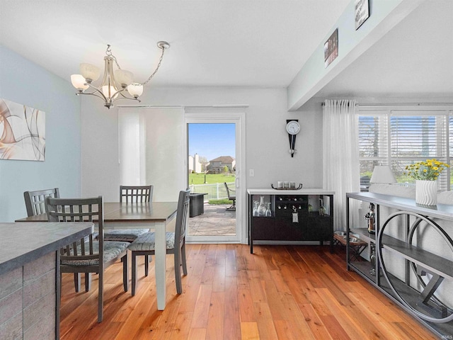 5326 Dennison Dr, Fort Wayne, IN 46835 - dining space featuring light wood-style flooring and a chandelier