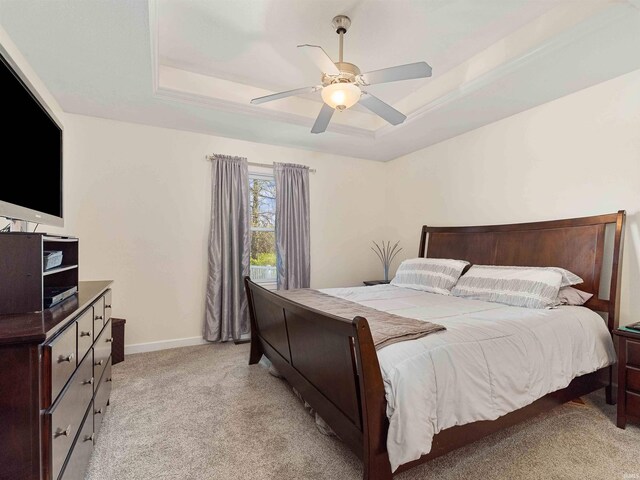 5326 Dennison Dr, Fort Wayne, IN 46835 - bedroom featuring baseboards, a raised ceiling, ceiling fan, and light carpet