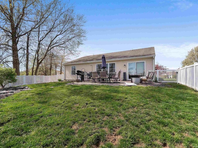 5326 Dennison Dr, Fort Wayne, IN 46835 - rear view of house with a yard, a fenced backyard, and a patio area