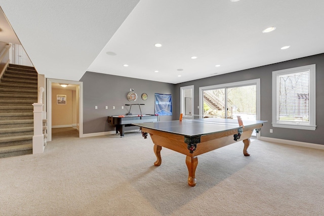 recreation room with light colored carpet, recessed lighting, and baseboards