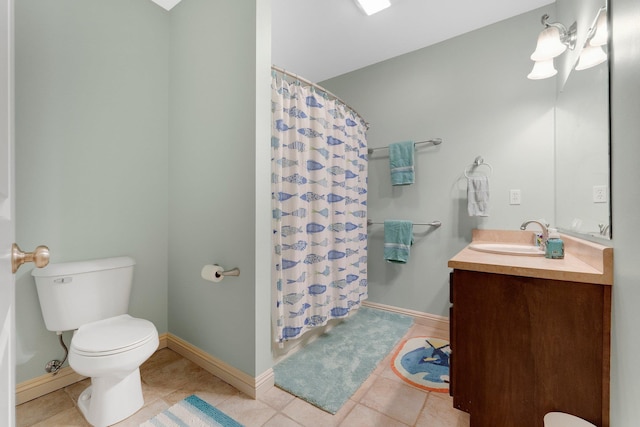 bathroom with vanity, tile patterned floors, toilet, and a shower with curtain