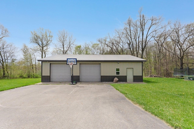 detached garage with a trampoline
