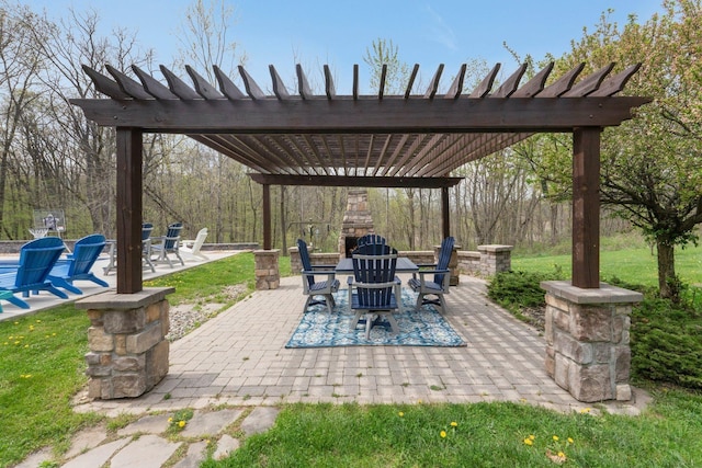 view of patio featuring a pergola and outdoor dining space