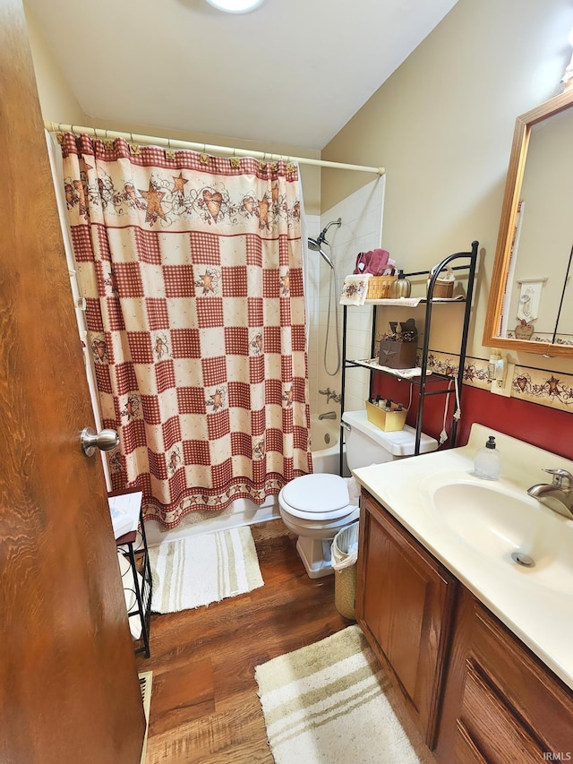 full bathroom with vanity, wood finished floors, shower / bath combo, and toilet
