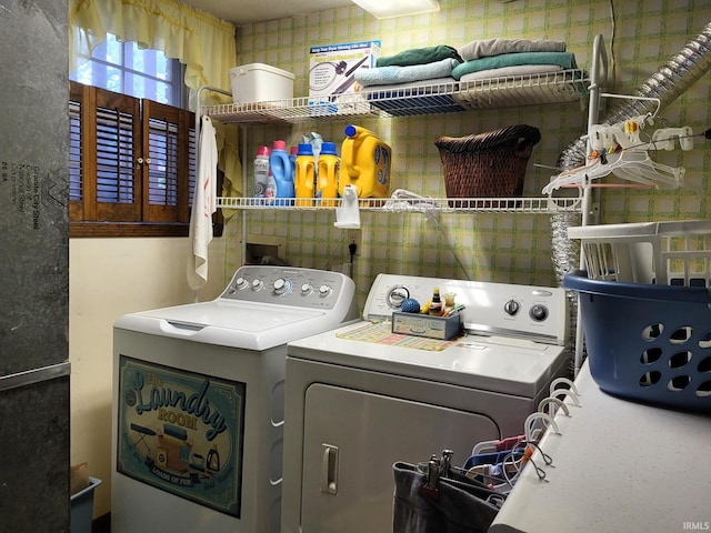 laundry area with laundry area and washer and clothes dryer