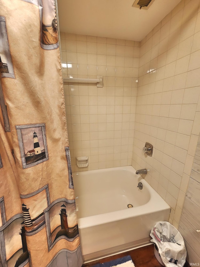 bathroom featuring shower / bath combo with shower curtain