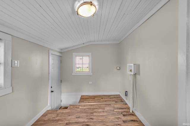 laundry room with baseboards, laundry area, wooden ceiling, and wood finished floors