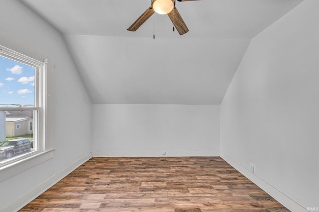 bonus room with wood finished floors, a ceiling fan, and lofted ceiling