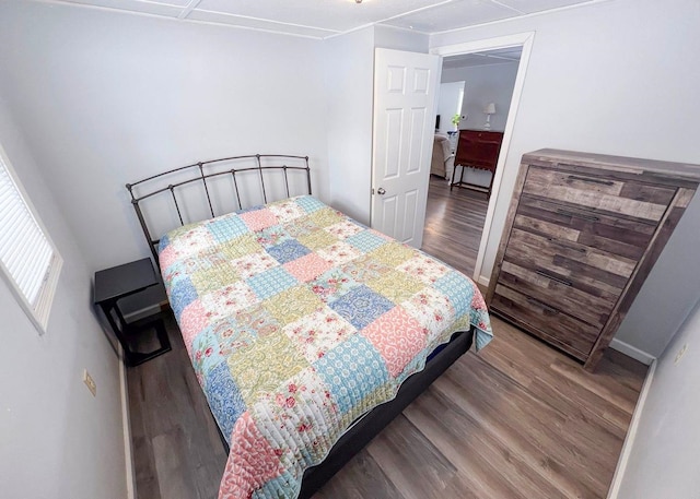 bedroom with wood finished floors
