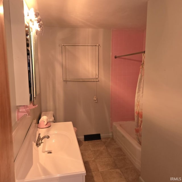 full bathroom with shower / bath combo with shower curtain and vanity