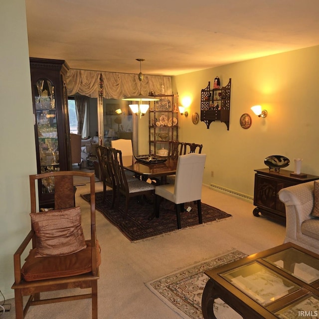 dining room with carpet flooring and a baseboard heating unit
