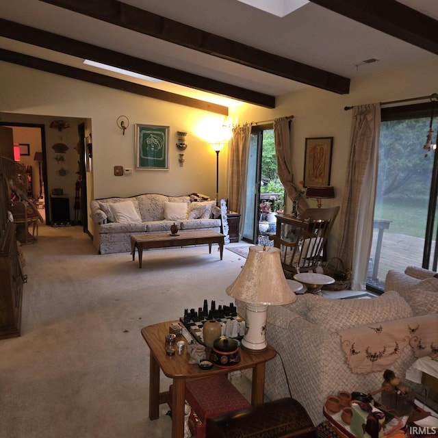 living room featuring carpet floors and beamed ceiling